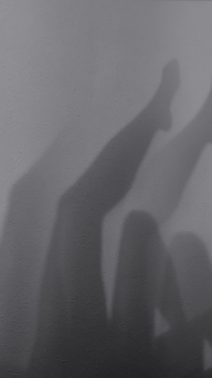 Abstract fine art shadow study on textured wall by Andrea Polmüller